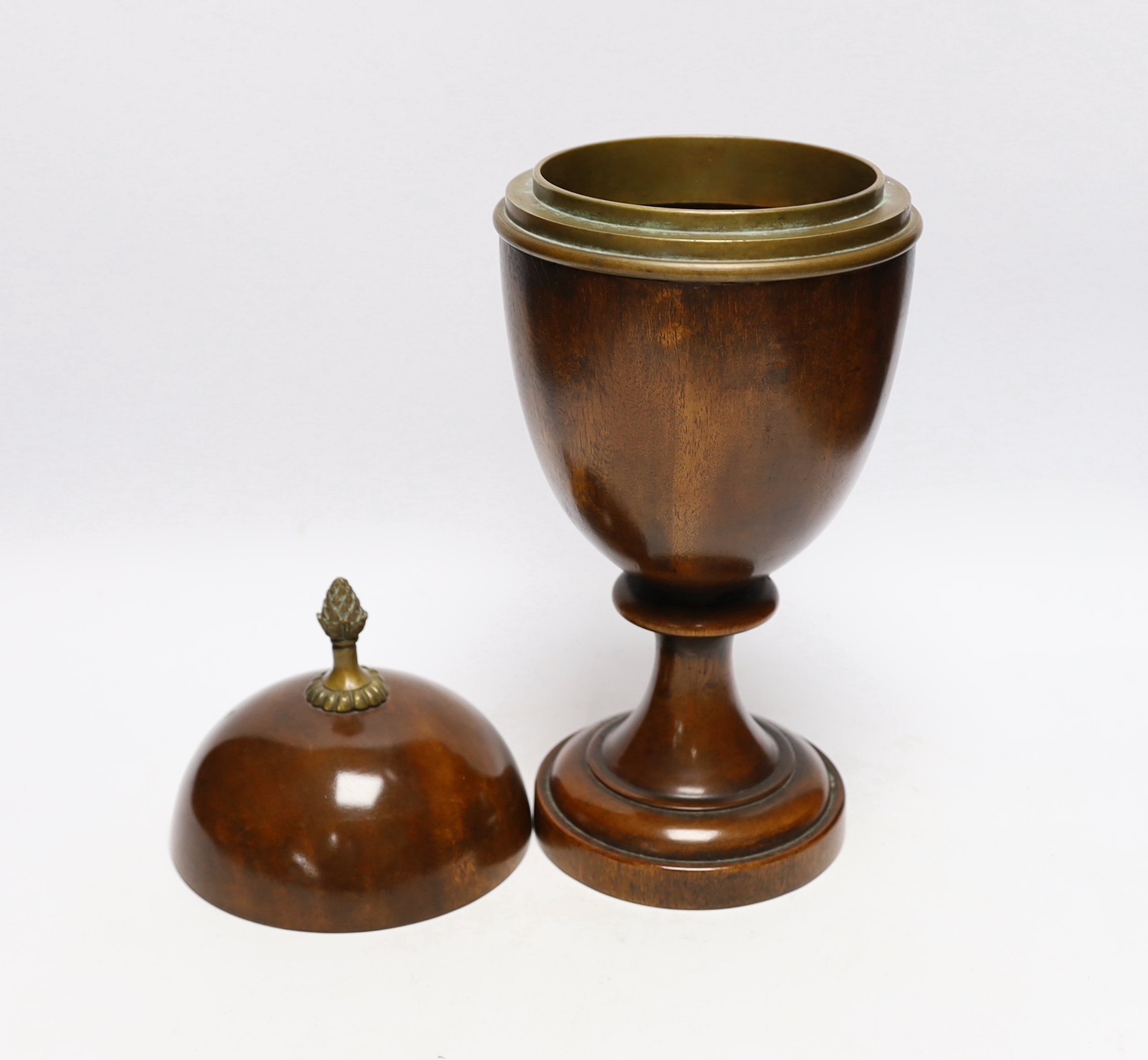 A turned wood urn and cover with brass acorn finial, 37cm high